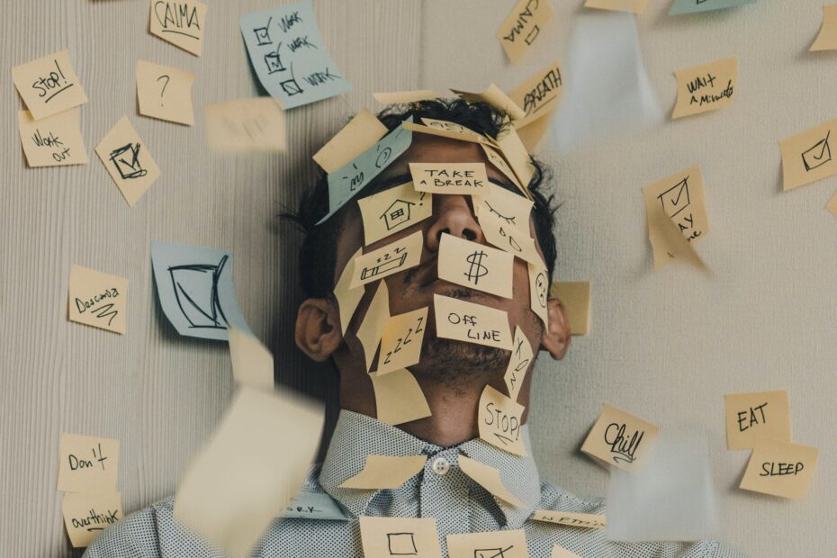 A photo of a person covered in sticky notes.