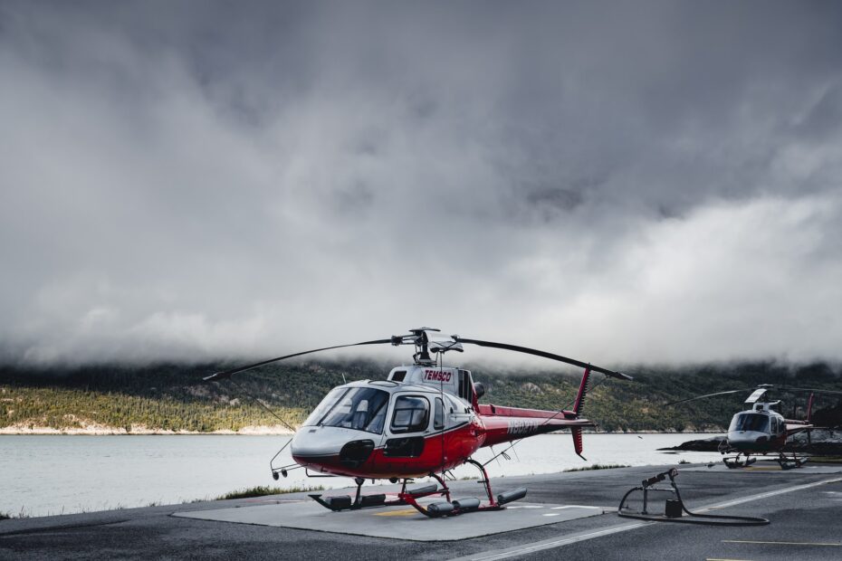 helicopter-on-landing-pad-with-grey-clouds-behind-it